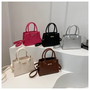 Collection of five elegant stone textured handbags in various colors with gold hardware