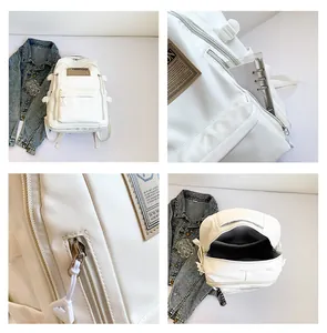 Detail view of large capacity white backpack with nylon texture and front zipper pocket