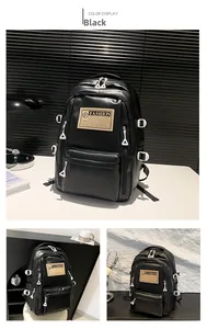 Detail view of black PU leather backpack with fashion patch and metallic zippers
