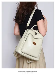 Side view of a cream large-capacity backpack featuring geometric stitching on faux leather