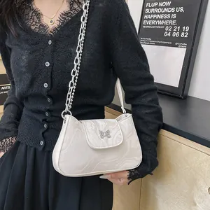 Off-white marble textured underarm bag with metal butterfly and double chain strap