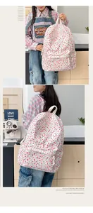 Sac à dos en toile à fleurs avec poignée et poche avant spacieuse pour étudiants