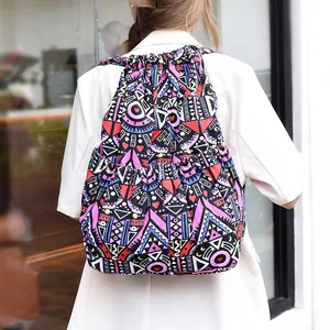 Detailed view of colorful geometric tribal pattern on a drawstring bucket backpack