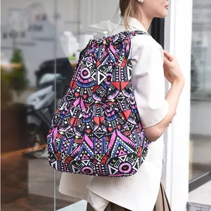 Close-up of geometric pattern drawstring backpack with side pockets and ethnic motifs