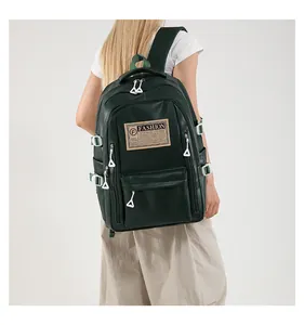 Rear view of model wearing dark green large capacity PU leather backpack with side buckles