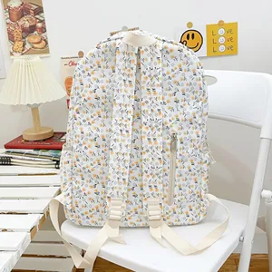 Sac à dos floral en toile avec motif de fleurs jaunes et bleues et bretelles