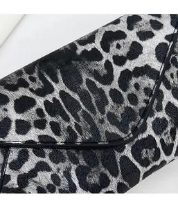 Macro shot of snow leopard print on high-quality lychee grain synthetic leather