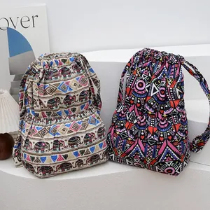Ethnic style drawstring backpacks with colorful patterns and dual front pockets
