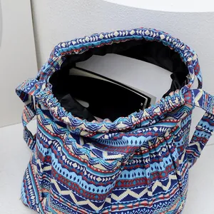 Detail view of ethnic striped bucket bag with drawstring closure and spacious interior