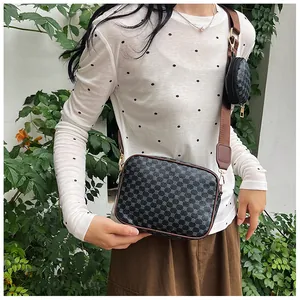 Detail of retro crossbody bag with geometric pattern and detachable round coin purse