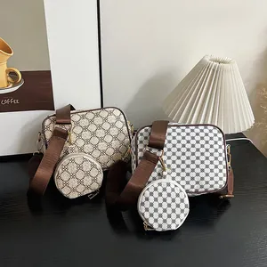 Detail of vintage square crossbody bags with matching mini coin pouches and wide straps