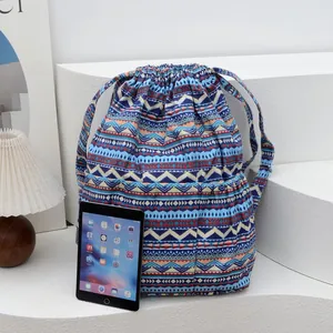 Detail of colorful geometric wave pattern canvas backpack with drawstring closure