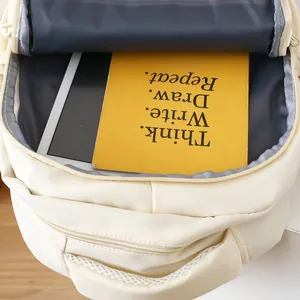 Top-down view of the spacious backpack main compartment holding a tablet and notebook