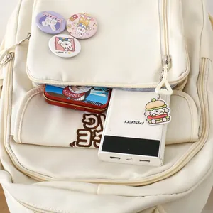 Detail of cream white nylon backpack pockets with cute badges and a dog keychain