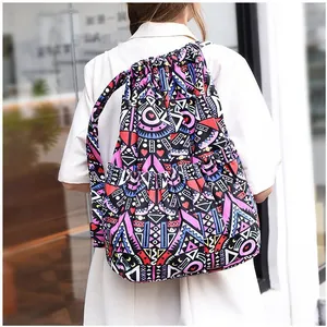 Ethnic style drawstring backpack with colorful geometric patterns and side pockets