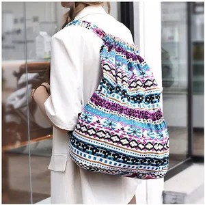 Outdoor shot of a colorful bohemian drawstring backpack with ethnic knit patterns