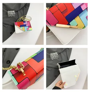 Detail view of colorful geometric flap, golden chain strap, and interior of the white bag