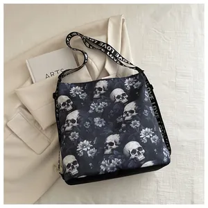 Detail of trendy nylon crossbody bag featuring gothic skull and flower prints