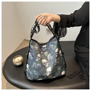 Macro shot of nylon crossbody bag featuring floral skull print and LOVE LOVE logo strap