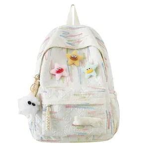 Quilted white backpack with wave embroidery and colorful plush star charms for school