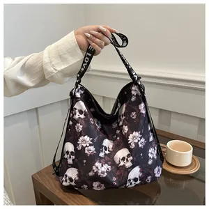 Detail of nylon crossbody bag with floral skull print and LOVE pattern strap