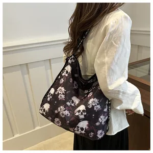 Close-up of a floral skull print nylon tote bag with Love patterned webbing shoulder strap