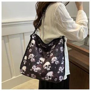 Detail of gothic floral skull print nylon tote bag with LOVE lettered shoulder strap