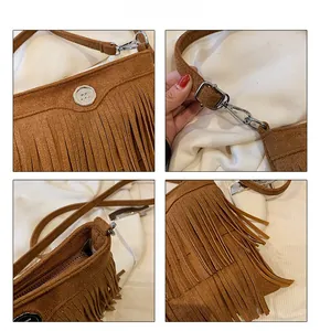 Close-up of brown suede crossbody bag featuring long bohemian tassels and silver metal logo