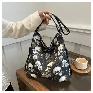 Detail of nylon crossbody bag featuring white skull floral print and LOVE lettered strap