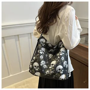 Model wearing a black nylon crossbody bag with white skull and floral print patterns