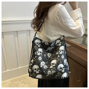 Detail of nylon crossbody bag with skull floral print and LOVE lettering on strap