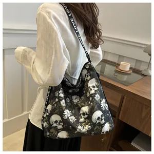 Detail of floral skull print nylon tote bag with LOVE lettered wide shoulder strap