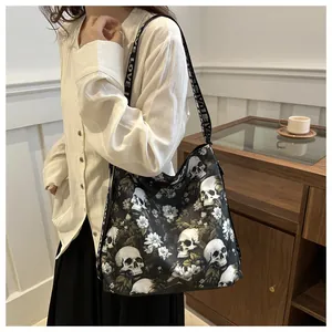 Close-up of nylon crossbody bag with skull floral print and LOVE lettered strap