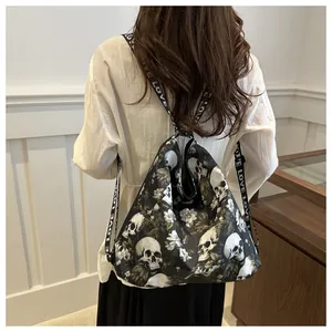 Detail of floral skull pattern on black nylon drawstring backpack with LOVE strap