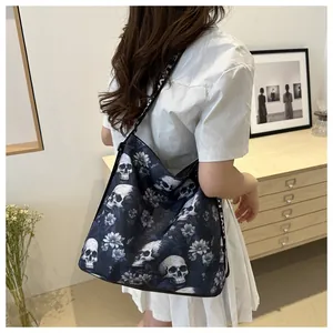 Detailed side view of nylon crossbody bag with skull floral print and LOVE strap