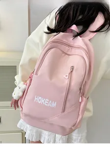 Pink waterproof nylon backpack with white HOKEAM logo and plush charm detail