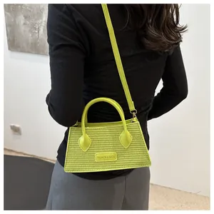 Neon green woven crossbody bag styled on a person for size and fit reference