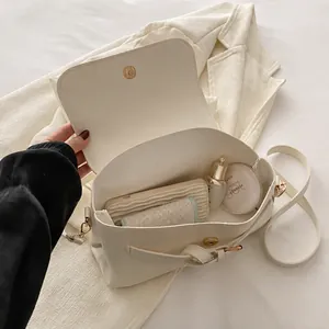 Interior view showing the storage capacity of the cream white crossbody square bag