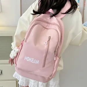 Pink waterproof nylon backpack for students with large capacity and cute cat pendant