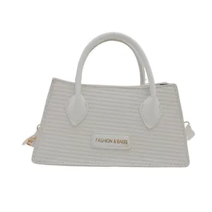 Chic off-white woven texture handbag with top handles and adjustable shoulder strap