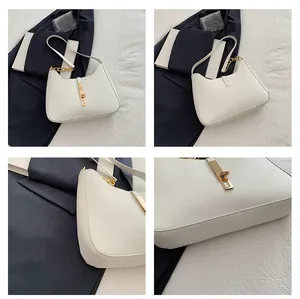 Detailansicht der weißen Sichltasche mit goldener Schließe und hochwertigen Nähten