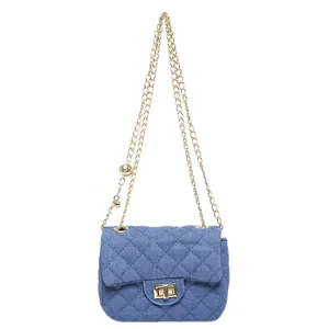 Blue denim crossbody bag with diamond quilted pattern and golden metal chain strap