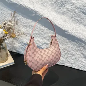 Pink crescent moon hobo bag with monogram pattern for women, autumn fashion style