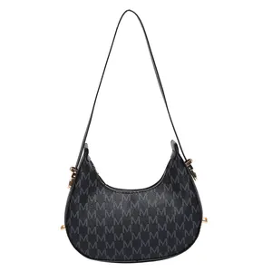 Retro black crescent shoulder bag with repeat letter print and golden zipper detail