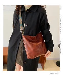 Brown retro leather tote bag featuring ethnic jacquard wide shoulder strap detail