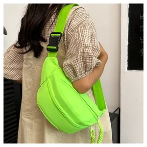 Neon green crossbody chest bag in waterproof nylon with sporty adjustable strap