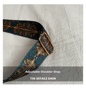 Detail of bohemian geometric woven shoulder strap with adjustable bronze buckle