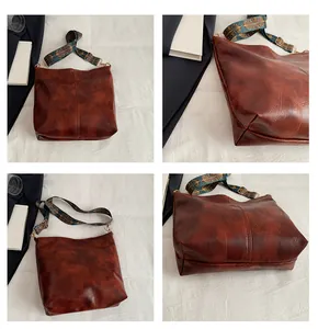 Detail view of vintage brown tote bag with patchwork seams and jacquard strap