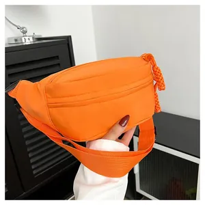 Waterproof orange crossbody fanny pack with adjustable strap for sports and casual wear