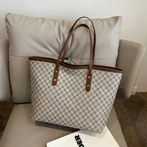 Classic canvas tote bag with geometric pattern and brown leather handles for daily commute